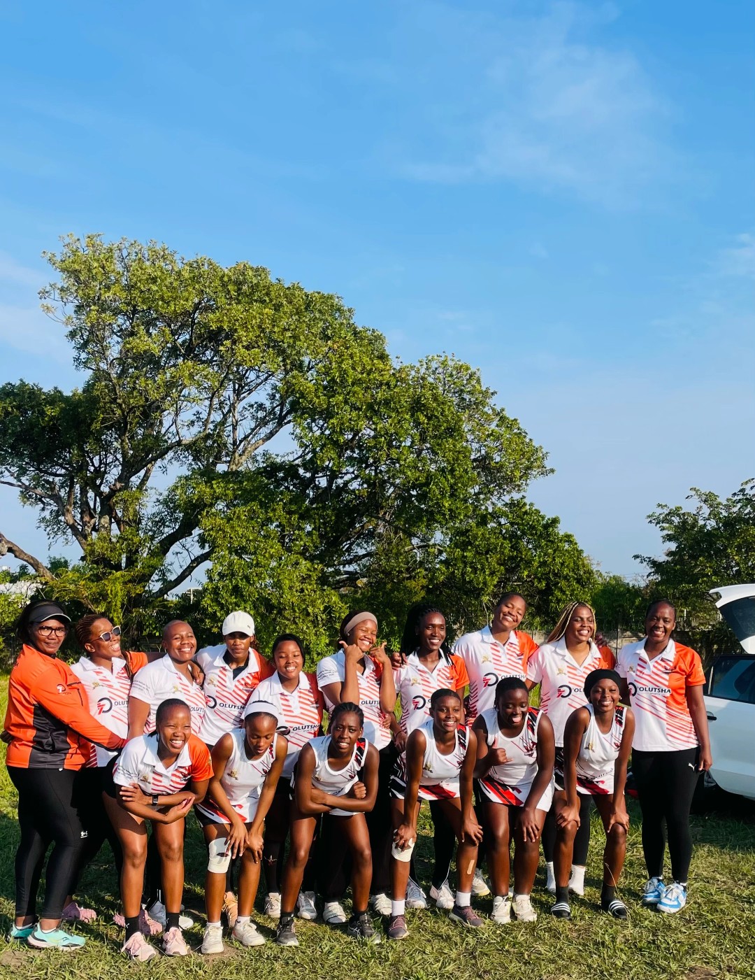 Olutsha Sunbirds players and coaches together before a match