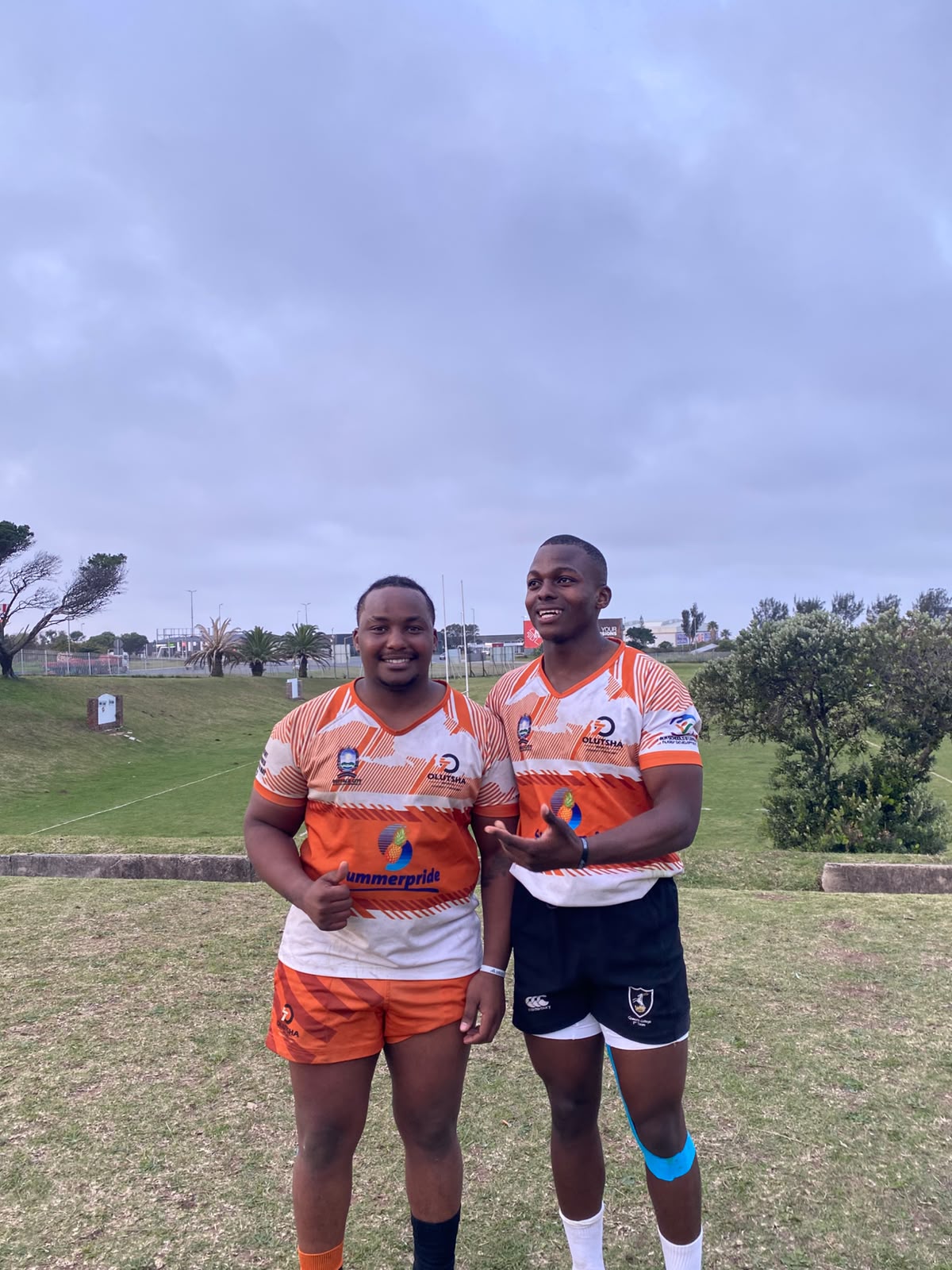Two Olutsha Wolves players in the 2026 Summerpride jersey on the field