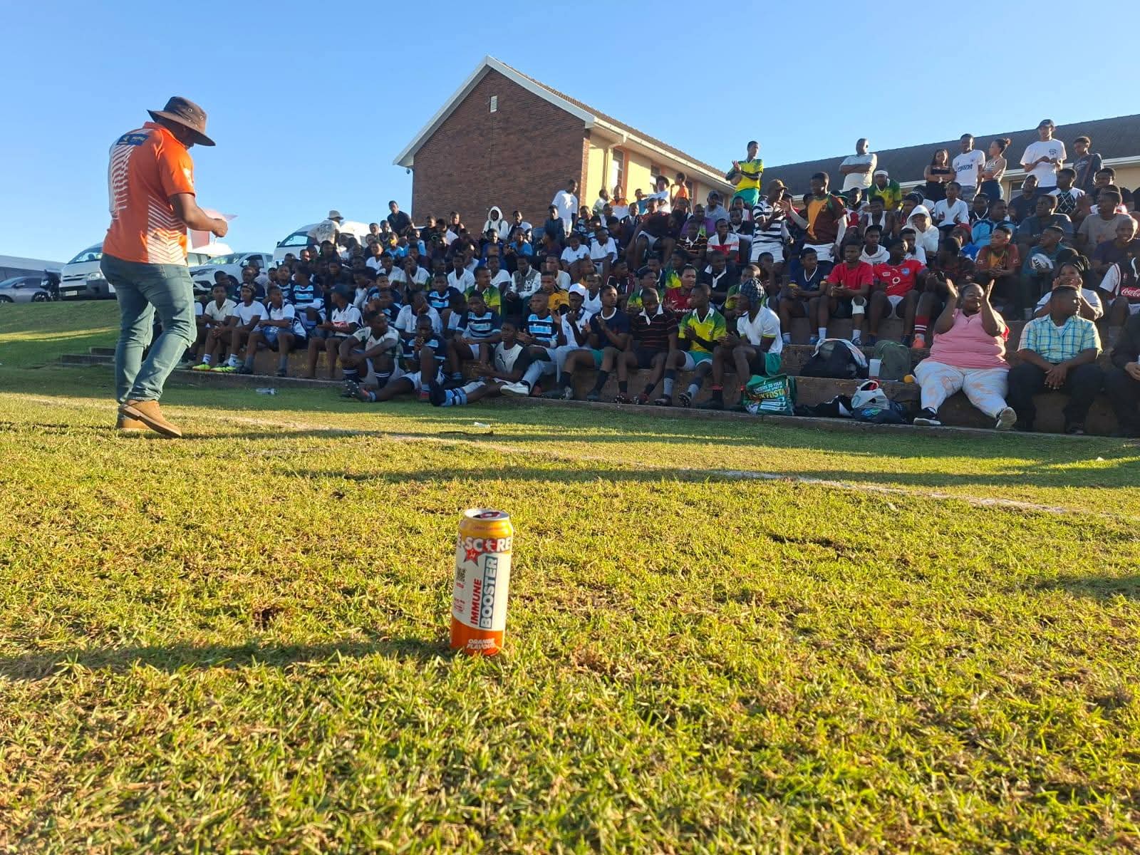 Crowd of young players seated on the grandstand at the Olutsha Rugby Academy launch
